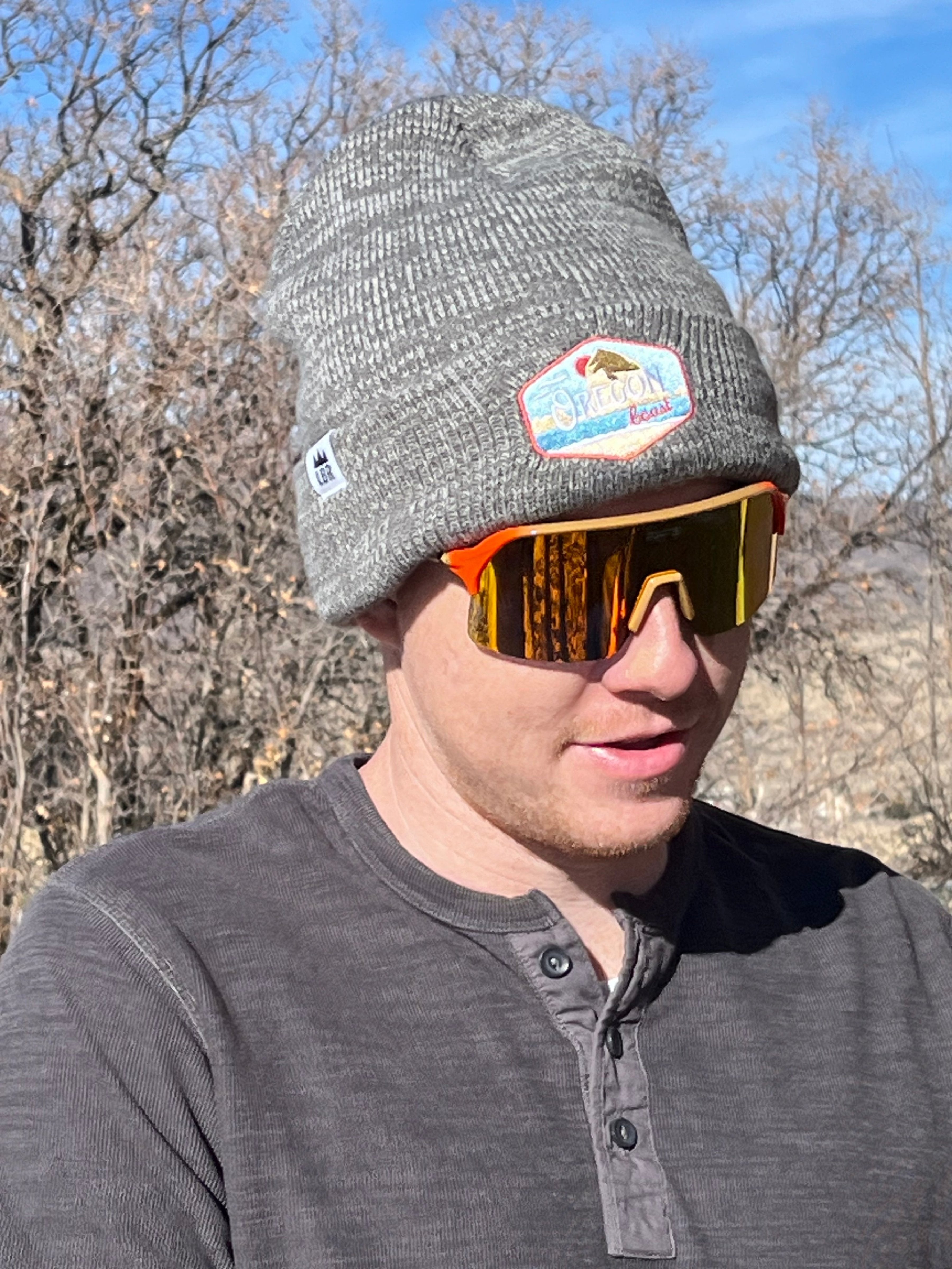 Man wearing Fat's Yellowstone Cutthroat Trout Sunglasses with Orange Polarized Lens